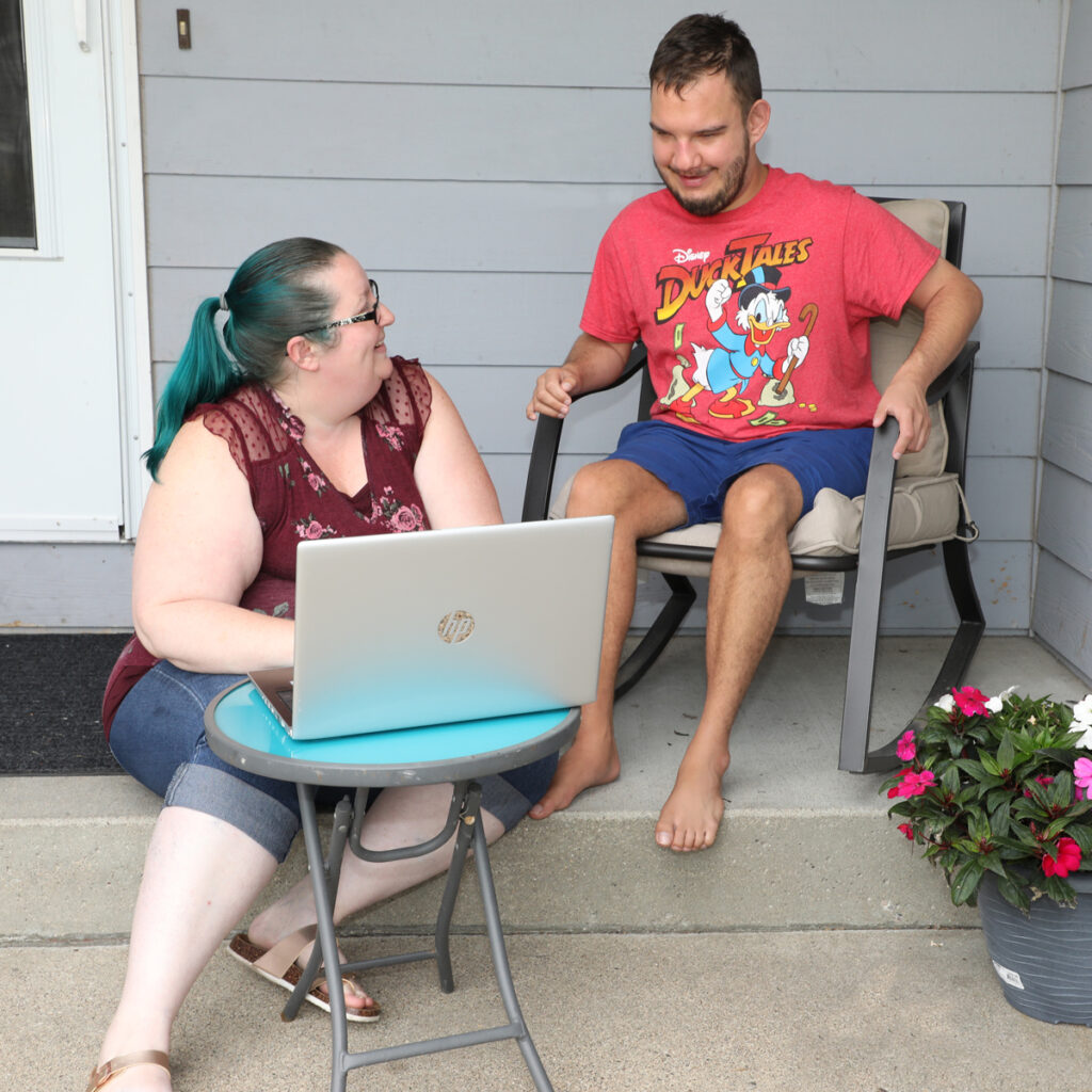 talking w case worker on front porch